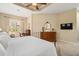 Main bedroom with king bed, TV, and ample closet space at 7223 Orchid Island Pl, Bradenton, FL 34202