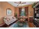 Well-appointed office offering hardwood floors, ceiling fan, sofa, and desk at 7223 Orchid Island Pl, Bradenton, FL 34202