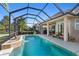 Inviting screened pool with a water feature, perfect for relaxation at 7223 Orchid Island Pl, Bradenton, FL 34202