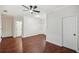 Bright bedroom with wood flooring and access to a bathroom at 787 San Salvador Dr, Dunedin, FL 34698