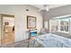 Bright bedroom with a comfortable bed and view into living area at 805 Harrington Lake N Dr # 76, Venice, FL 34293