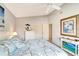 Bedroom with ceiling fan, double closets, and calming decor at 805 Harrington Lake N Dr # 76, Venice, FL 34293