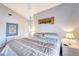 Serene bedroom with a king-size bed and calming decor at 805 Harrington Lake N Dr # 76, Venice, FL 34293