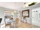 Casual dining area with glass table, and access to the backyard at 805 Harrington Lake N Dr # 76, Venice, FL 34293