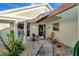 Inviting front entry with walkway, landscaping, and charming door at 805 Harrington Lake N Dr # 76, Venice, FL 34293