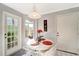 Bright kitchen nook with white table and chairs at 805 Harrington Lake N Dr # 76, Venice, FL 34293