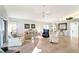 Bright living room featuring comfortable seating and tile floors at 805 Harrington Lake N Dr # 76, Venice, FL 34293