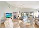 Spacious living room with access to a relaxing patio overlooking a lake at 805 Harrington Lake N Dr # 76, Venice, FL 34293