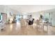 Spacious living area with tile floors, comfortable furniture, and access to lanai at 805 Harrington Lake N Dr # 76, Venice, FL 34293