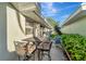 Cozy patio with table and chairs, perfect for outdoor dining at 805 Harrington Lake N Dr # 76, Venice, FL 34293
