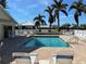 Inviting community pool with lounge chairs and patio area at 805 Harrington Lake N Dr # 76, Venice, FL 34293