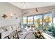 Sunroom with lake view and comfortable seating at 805 Harrington Lake N Dr # 76, Venice, FL 34293