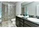 Modern bathroom with double vanity and large shower at 8608 Stargazer St, Sarasota, FL 34238
