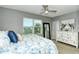 Bright bedroom featuring a comfortable bed and ample dresser storage at 8608 Stargazer St, Sarasota, FL 34238