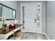 Inviting entryway with a console table and mirror at 8608 Stargazer St, Sarasota, FL 34238
