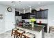 Modern kitchen with dark cabinetry, granite counters, and stainless steel appliances at 8608 Stargazer St, Sarasota, FL 34238