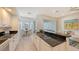 Modern kitchen with white cabinets, granite counters and breakfast nook at 8753 Pebble Creek Ln, Sarasota, FL 34238