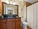 Well-appointed bathroom with granite vanity and tiled shower at 1214 Sea Plume Way, Sarasota, FL 34242