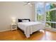 Bright bedroom with bamboo floors and large windows at 1214 Sea Plume Way, Sarasota, FL 34242