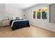 Comfortable guest bedroom with tile flooring and exterior access at 1214 Sea Plume Way, Sarasota, FL 34242
