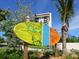 Siesta Key Village entrance sign with tropical designs at 1214 Sea Plume Way, Sarasota, FL 34242