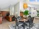 Open concept dining room with round table and modern chairs at 1214 Sea Plume Way, Sarasota, FL 34242