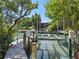 Wooden dock with lift for boats at 1214 Sea Plume Way, Sarasota, FL 34242