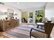 Spacious entryway with tiled floor, featuring comfortable seating and natural light at 1214 Sea Plume Way, Sarasota, FL 34242