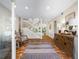 Bright and airy entryway with tiled floor and wooden console table at 1214 Sea Plume Way, Sarasota, FL 34242