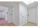 Clean hallway with access to stairs and other rooms at 1214 Sea Plume Way, Sarasota, FL 34242