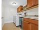 Laundry room with washer, dryer, and wine cooler at 1214 Sea Plume Way, Sarasota, FL 34242