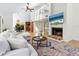 Open concept living room with sectional sofa and fireplace at 1214 Sea Plume Way, Sarasota, FL 34242