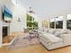 Bright living room with vaulted ceiling, fireplace and large windows at 1214 Sea Plume Way, Sarasota, FL 34242