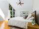 Bright main bedroom with high ceilings and hardwood floors at 1214 Sea Plume Way, Sarasota, FL 34242