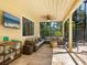 Spacious covered patio with sectional sofa and TV at 1214 Sea Plume Way, Sarasota, FL 34242