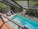 Inviting swimming pool with a view of lush landscaping at 1214 Sea Plume Way, Sarasota, FL 34242