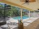 Large pool with surrounding patio and spiral staircase at 1214 Sea Plume Way, Sarasota, FL 34242