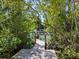 Wooden walkway leads to a dock on a calm waterway at 1214 Sea Plume Way, Sarasota, FL 34242