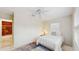 Third bedroom with a bed, ceiling fan, and ensuite bathroom access at 1220 26Th W St, Bradenton, FL 34205