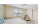 A different angle of the bedroom showcasing the bed, chair, closet, and window at 1220 26Th W St, Bradenton, FL 34205