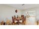 Dining area with a round wooden table and chairs, adjacent to the kitchen at 1220 26Th W St, Bradenton, FL 34205