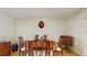 Dining room with a round table, seating for six, and decorative wall art at 1220 26Th W St, Bradenton, FL 34205