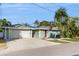 Charming single-story home with attached garage and lush landscaping at 1220 26Th W St, Bradenton, FL 34205