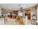 Modern kitchen with granite countertops, stainless steel appliances, and breakfast bar at 1220 26Th W St, Bradenton, FL 34205