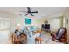 Bright living room with blue couches, a flat-screen TV, and decorative accents at 1220 26Th W St, Bradenton, FL 34205