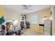 Home office or den with a desk, chair, filing cabinet, and window with blinds at 1220 26Th W St, Bradenton, FL 34205