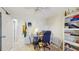 A second view of the home office/den space with a desk, chair, and storage at 1220 26Th W St, Bradenton, FL 34205