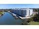 Aerial view of waterfront condo building with boat slips at 1709 N Tamiami Trl # 215, Sarasota, FL 34234