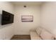 Cozy den with comfortable sofa and large wall-mounted TV at 1709 N Tamiami Trl # 215, Sarasota, FL 34234
