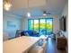 Bright living room with water views and comfortable seating at 1709 N Tamiami Trl # 215, Sarasota, FL 34234